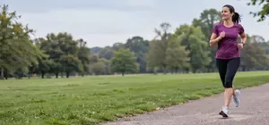Lady running along park path
