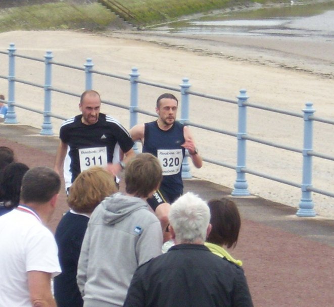 Andrew running for the finishing line - Morecambe 10k