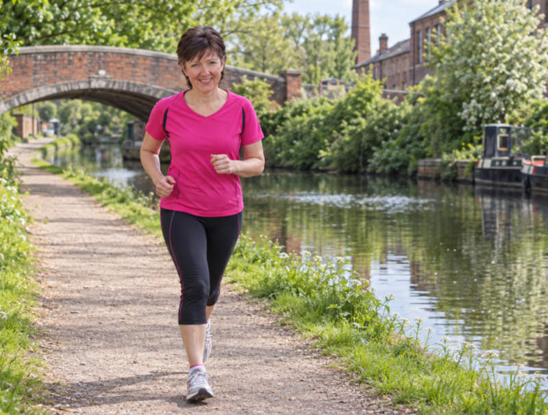 Julie running on Ashton canal